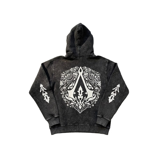 Dark grey acid wash hoodie with small Assassin's Creed logo on front and large ornate crest on back with sleeve details - gaming streetwear by Stick-On Limited.