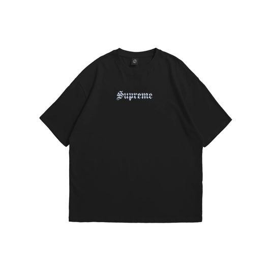 A black oversized t-shirt shown from the front and back, featuring a metallic gothic 'Supreme' logo on the chest and a large rectangular back graphic with heavy chains, tribal flames, and stars - streetwear apparel by Stick-On Limited.
