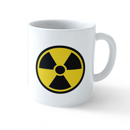 White ceramic coffee mug featuring a bold black and yellow radiation hazard symbol design