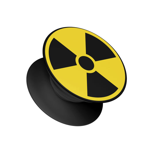 A black pop socket phone grip featuring a top design of a yellow and black radioactive hazard symbol - edgy phone accessory by Stick-On Limited.