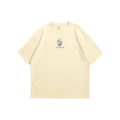 A cream oversized t-shirt shown from the front and back, featuring a small blue France FFF rooster on the chest and a large intricate navy line-art illustration of a rooster containing French landmarks on the reverse - sports streetwear apparel by Stick-On Limited.
