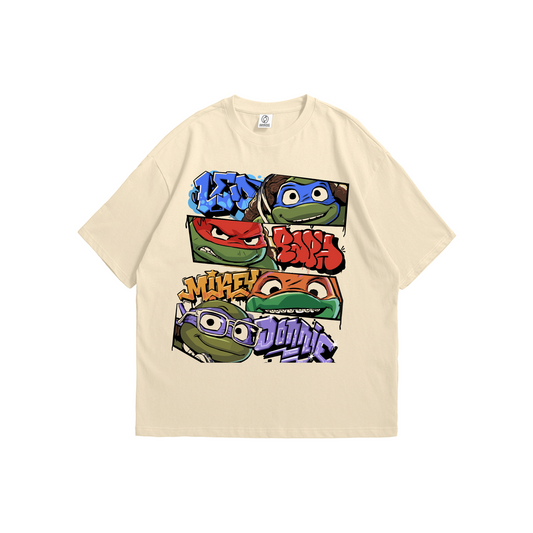 Beige t-shirt featuring Teenage Mutant Ninja Turtles faces with colorful graffiti names - pop culture streetwear by Stick-On Limited.