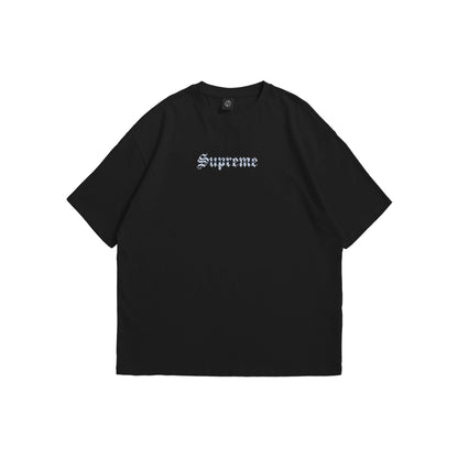 A black oversized t-shirt shown from the front and back, featuring a metallic gothic 'Supreme' logo on the chest and a large rectangular back graphic with heavy chains, tribal flames, and stars - streetwear apparel by Stick-On Limited.