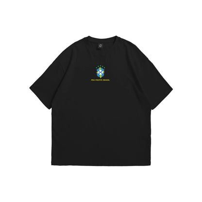A black oversized t-shirt shown from the front and back, featuring the Brazil CBF crest on the chest and a large intricate yellow line-art illustration of Brazilian landmarks and five stars on the reverse - sports streetwear apparel by Stick-On Limited.