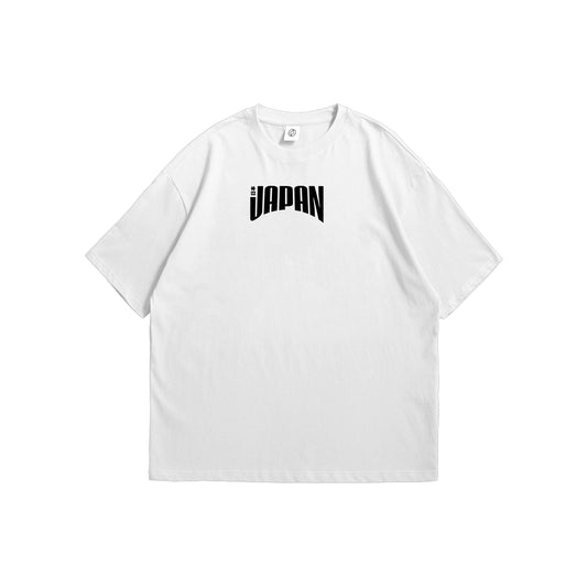 Front and back view of a white t-shirt featuring a minimalist black Japan logo on the front chest and a bold orange Seigaiha wave graphic on the back - streetwear apparel by Stick-On Limited.