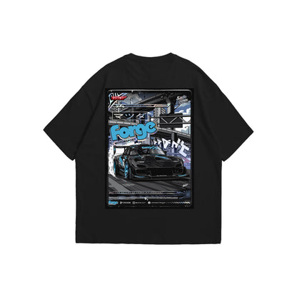 A black oversized t-shirt shown from the front and back. The front features a blue 'Forge Motorsport' logo in the center of the chest. The back displays a large, vibrant, comic-style graphic of a black modified JDM sports car drifting under a city overpass, framed by Japanese text, 'Saito Legends', and other motorsport branding.