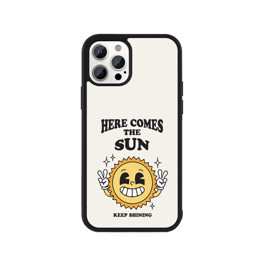 A white smartphone case featuring a retro smiling sun illustration with 'Here Comes The Sun' and 'Keep Shining' text and a protective black bumper - aesthetic vintage phone accessory by Stick-On Limited.