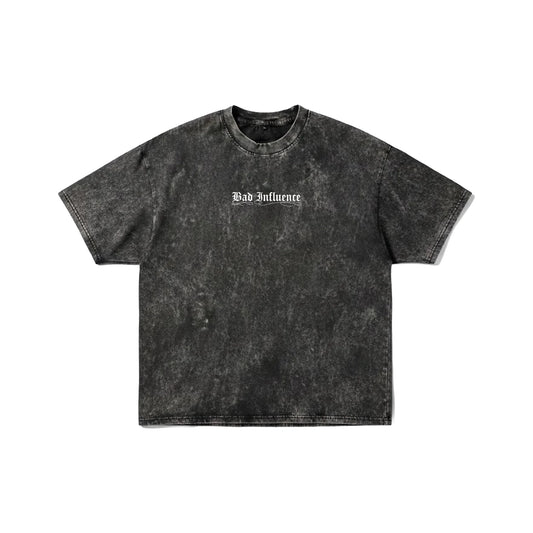 Dark grey acid wash t-shirt with "Bad Influence" gothic text on front and large white skeleton spine wings on back - grunge streetwear by Stick-On Limited.