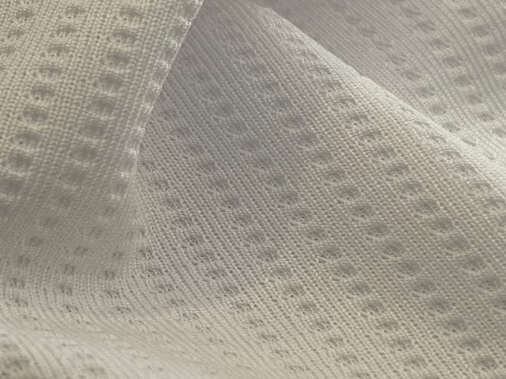 Close-up of textured gray fabric with a subtle pattern
